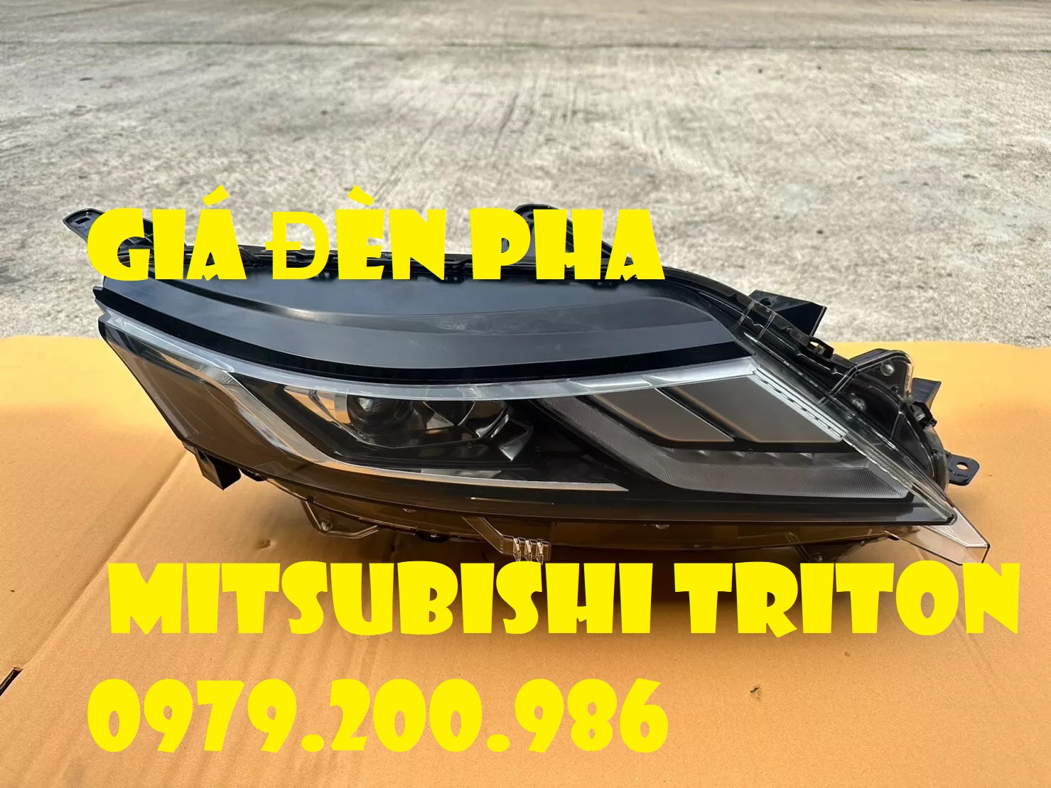 Gía đèn pha xe mitsubishi triton